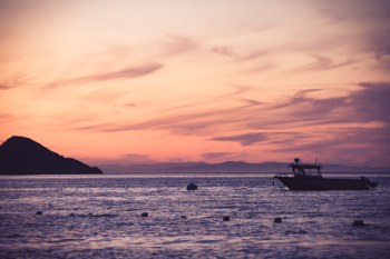 Boat on Sea during Golden Hour Boat on Sea during Golden Hour