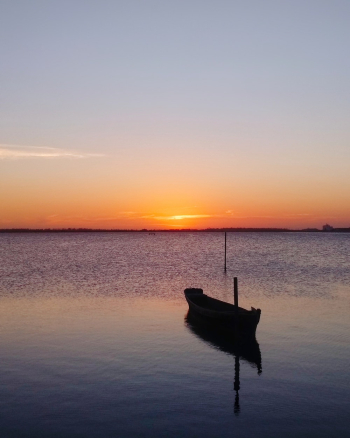 Boat on Water during Sunset Boat on Water during Sunset