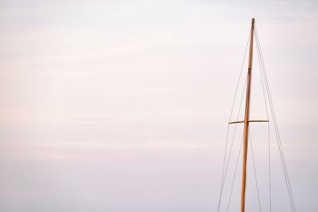 boat sail post during day boat sail post during day