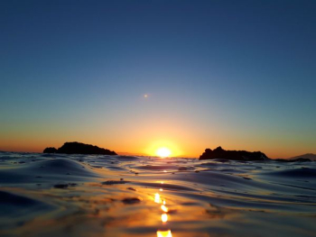 body of water during sunset body of water during sunset