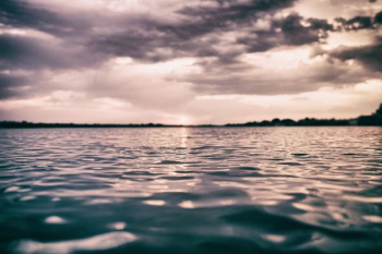 body of water during sunset body of water during sunset