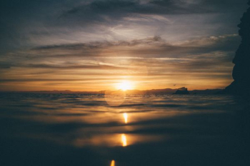 body of water during sunset body of water during sunset