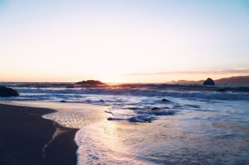 body of water during sunset body of water during sunset