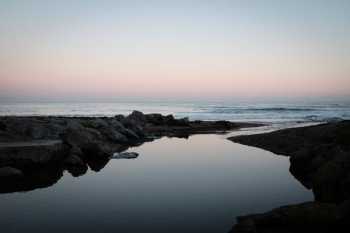 body of water during sunset body of water during sunset