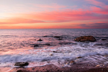 body of water during sunset body of water during sunset