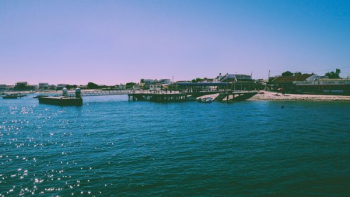 body of water near buildings at daytime body of water near buildings at daytime