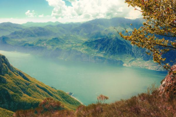 body of water surrounded with mountains body of water surrounded with mountains