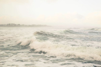 body of water under cloud