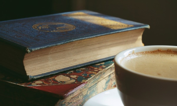 Book Beside Cup Filled With Brown Liquid Book Beside Cup Filled With Brown Liquid