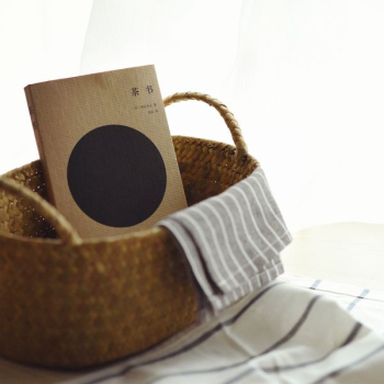 book inside brown wicker basket book inside brown wicker basket