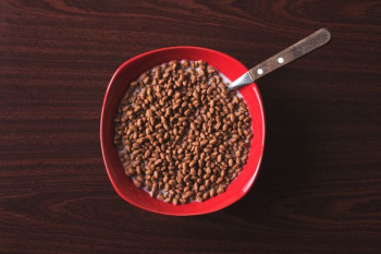 bowl of cereal with spoon on tabletop bowl of cereal with spoon on tabletop