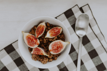 Bowl of crunchy granola and figs Bowl of crunchy granola and figs