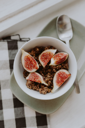 Bowl of crunchy granola and figs Bowl of crunchy granola and figs