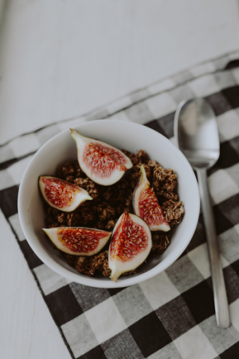 Bowl of crunchy granola and figs Bowl of crunchy granola and figs