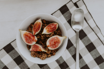 Bowl of crunchy granola and figs Bowl of crunchy granola and figs