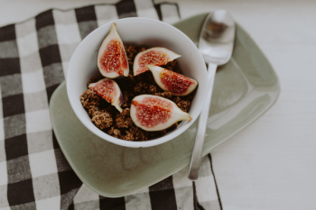 Bowl of crunchy granola and figs Bowl of crunchy granola and figs