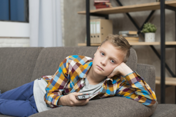 Boy bored on couch Boy bored on couch
