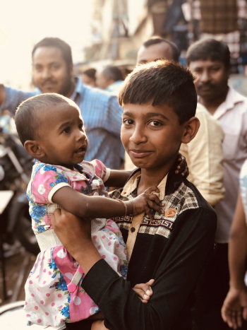 Boy Carrying a Child Boy Carrying a Child