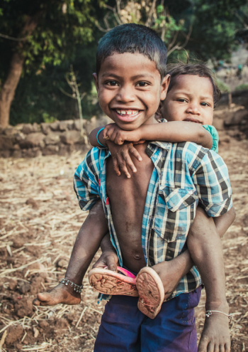 Boy Carrying a Child Boy Carrying a Child