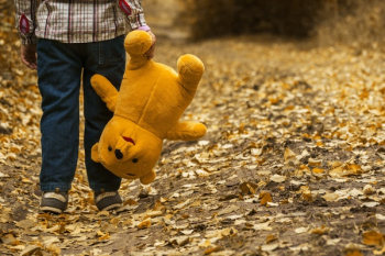 Boy Carrying Bear Plush Toy Boy Carrying Bear Plush Toy