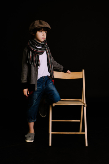 Boy Holding Brown Wooden Chair Boy Holding Brown Wooden Chair