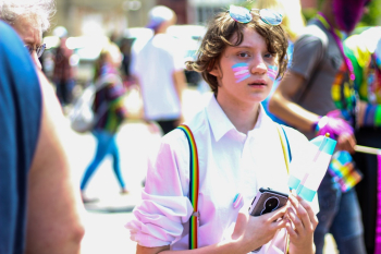 Boy Holding Smartphone and Flaglet Boy Holding Smartphone and Flaglet