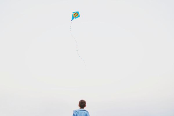 boy playing kite boy playing kite