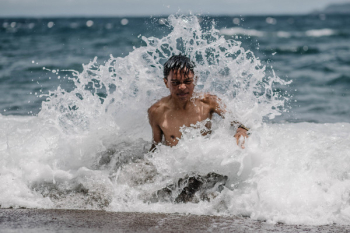 Boy Swimming on Sea Boy Swimming on Sea