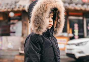 Boy Wearing Black Faux-Fur-Lined Hooded Parka Boy Wearing Black Faux-Fur-Lined Hooded Parka