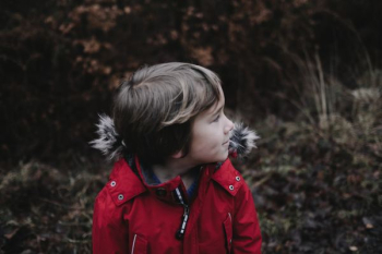 boy wearing red parka jacket boy wearing red parka jacket