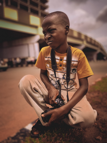 Boy Wearing Yellow and White Crew-neck T-shirt Boy Wearing Yellow and White Crew-neck T-shirt