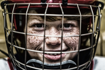 Boy With a Football Helmet Smiling Boy With a Football Helmet Smiling