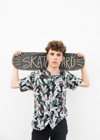 Boy with skateboard mockup Free Psd