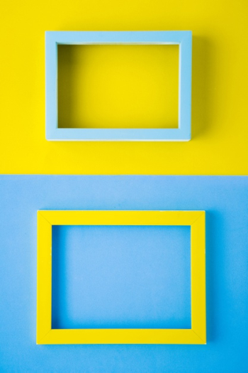 Bright colored frames on bicolor background Free Photo