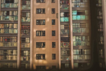brown apartment building brown apartment building