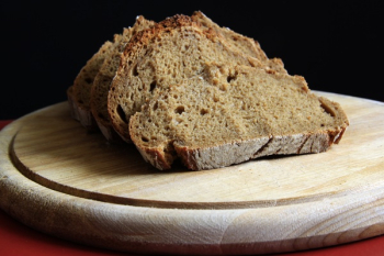 Brown Bread on Round Wooden Tray Brown Bread on Round Wooden Tray