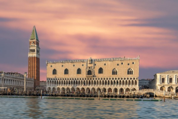 Brown Building With Body of Water Brown Building With Body of Water