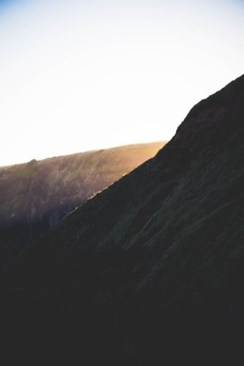 brown cliff during sunrise brown cliff during sunrise