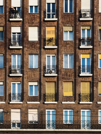 brown concrete apartment during daytime brown concrete apartment during daytime