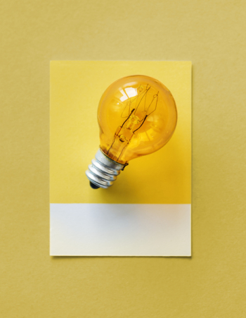Brown Light Bulb Photo on Yellow Surface Brown Light Bulb Photo on Yellow Surface