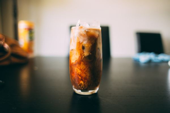 brown liquid inside clear drinking glass brown liquid inside clear drinking glass