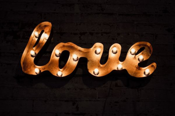 brown love text with light signage brown love text with light signage