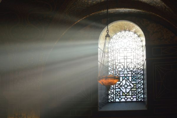 brown pendant lamp beside window