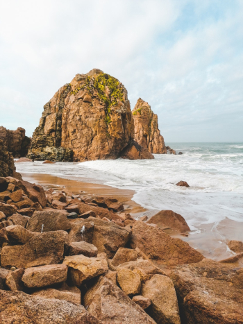 Brown Rock Formation on Sea Shore Brown Rock Formation on Sea Shore