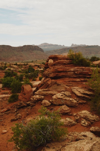 Brown Rocky Mountain Under White Cloudy Sky Brown Rocky Mountain Under White Cloudy Sky