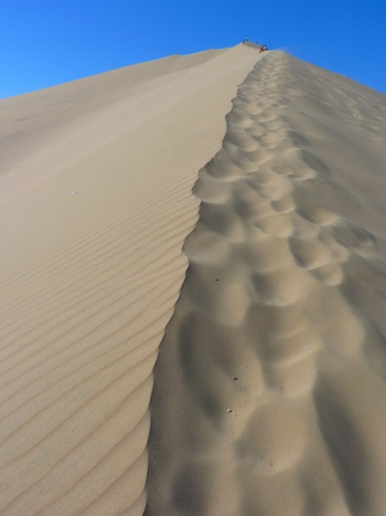 Brown Sand Dunes Under Blue Sky