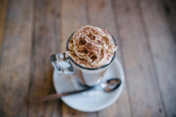 brown whip cream in clear glass cup brown whip cream in clear glass cup