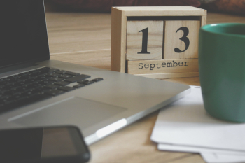 Brown Wooden Block Desk Calendar Displaying September 13 Brown Wooden Block Desk Calendar Displaying September 13