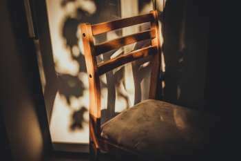 Brown Wooden Chair Beside White Painted Wall Brown Wooden Chair Beside White Painted Wall