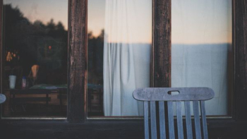 brown wooden chair near brown wooden door brown wooden chair near brown wooden door